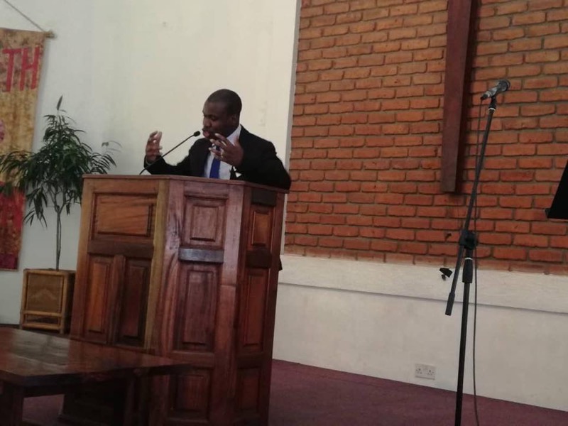 Confex Makhalira preaching at a pulpit in Malawi