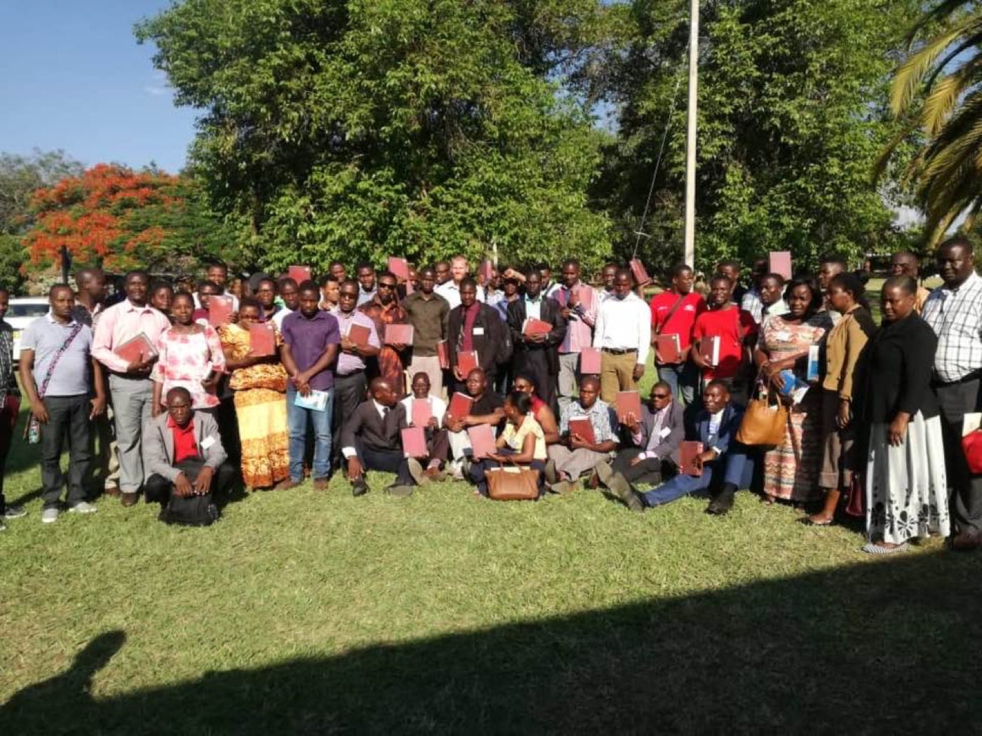 Pastors gathered at an MRN conference in Malawi, holding their new books